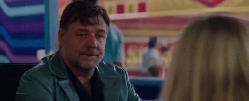 Man In Blue Jacket Sitting At Table GIF