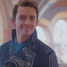 Man in Blue Jacket Smiling at Camera