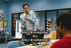 Man In Blue Jacket Talking To Man At Desk GIF