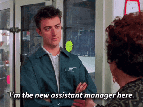 Man in Blue Jacket Talking to New Assistant Manager