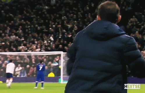 Man In Blue Jacket Watching Soccer Player Number 7 GIF