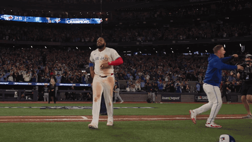 Man In Blue Jays Uniform Walking GIF