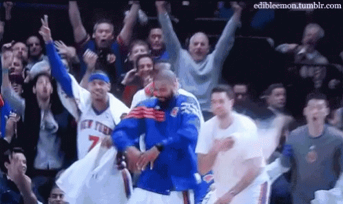 Man In Blue Jersey Dancing Before Crowd GIF