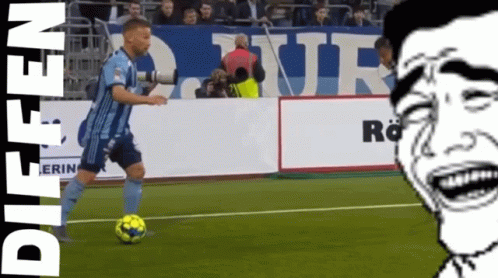 Man in Blue Jersey Kicking Soccer Ball