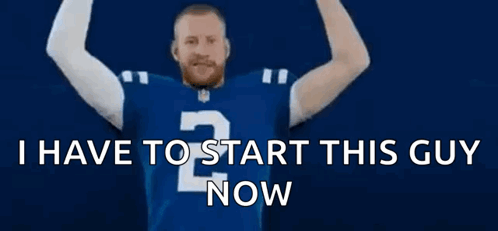 Man in Blue Jersey With Letter P Arms Outstretched