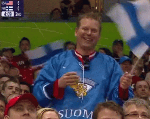 Man in Blue Jersey with Suon Holding Flag