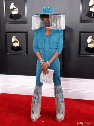 Man in Blue Jumpsuit and Silver Hat