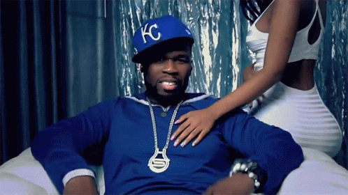 Man in Blue KC Hat Sitting on Couch