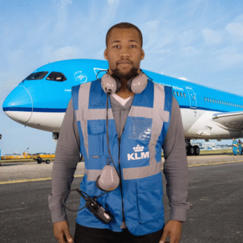 Man In Blue KLM Vest In Front Of Plane GIF