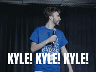 Man In Blue Kotakon Shirt Holding Microphone Saying Kyle GIF