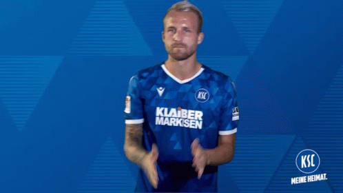 Man in Blue KSC Jersey Clapping