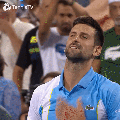 Man in Blue Lacoste Shirt Applauding Before Crowd
