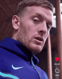 Man in Blue Nike Hoodie Looking at Camera
