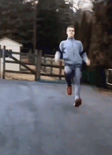 Man In Blue Nike Tracksuit Running GIF