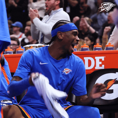 Man in Blue Oklahoma City Thunder Shirt Laughing