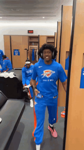 Man in Blue Oklahoma City Thunder Shirt Walking