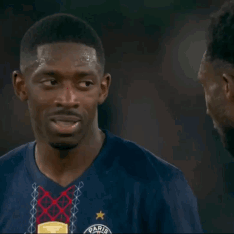 Man in Blue Paris Shirt Talking to Another