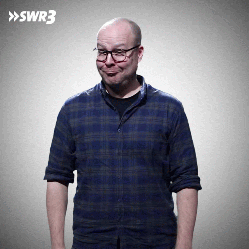 Man In Blue Plaid Shirt And Glasses By SWR3 Sign GIF