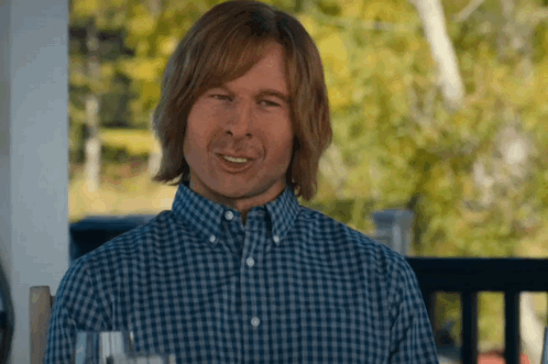 Man in Blue Plaid Shirt Smiling