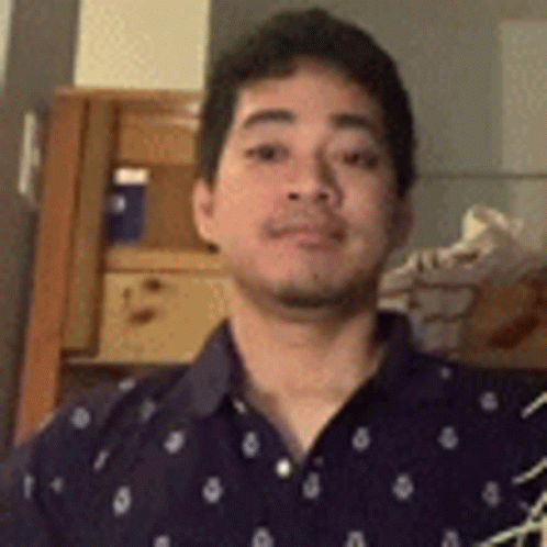 Man in Blue Polka Dot Shirt