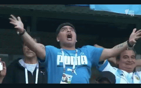 Man in Blue Puma Shirt Screaming Arms Outstretched
