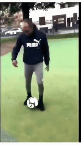 Man In Blue Puma Sweatshirt Kicking Soccer Ball GIF