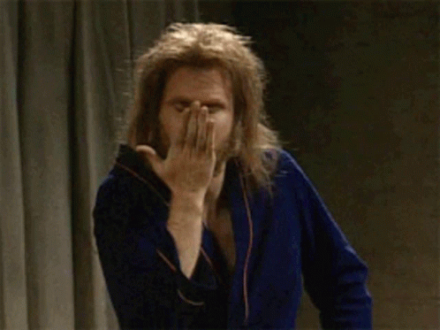 Man in Blue Robe Winking