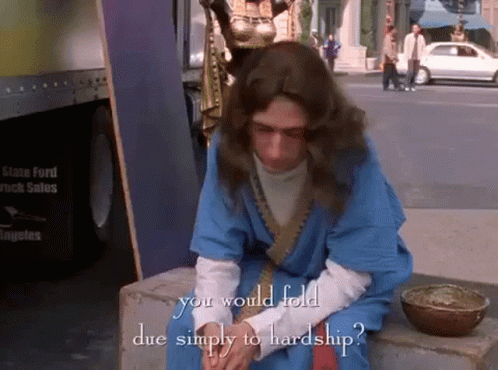 Man in Blue Robe with Text You Would Fold Due Simply to Hardship