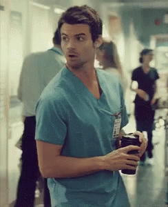 Man In Blue Scrub Top With Name Tag GIF