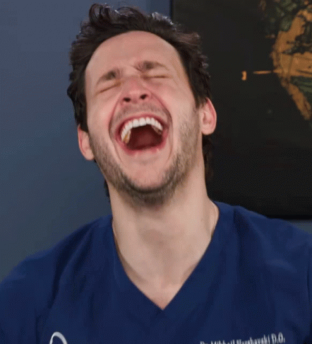 Man in Blue Scrubs Laughing