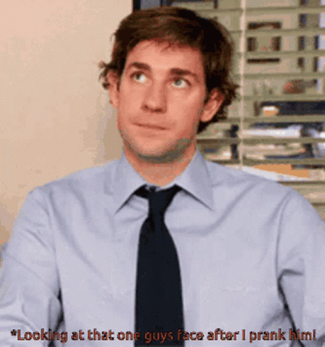 Man in Blue Shirt and Black Tie Saying Looking at That One Guy's Face After I Prank Him