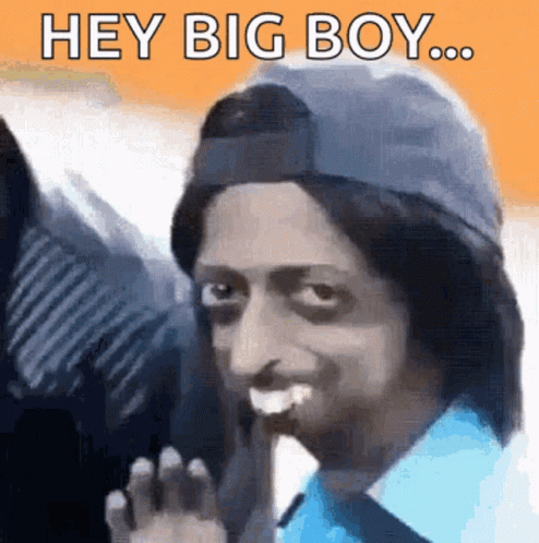 Man in Blue Shirt and Hat Says Hey Big Boy