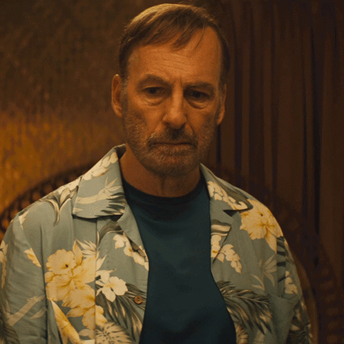 Man in Blue Shirt and Hawaiian Shirt