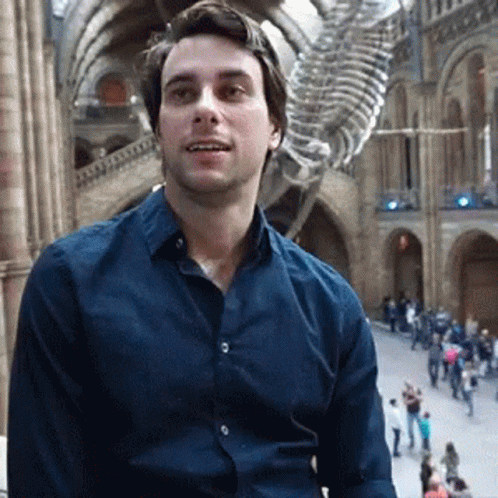 Man in Blue Shirt and Skeleton