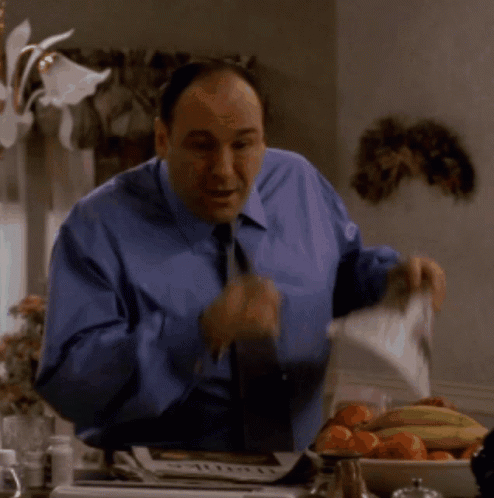 Man In Blue Shirt And Tie Holding AOL Newspaper GIF