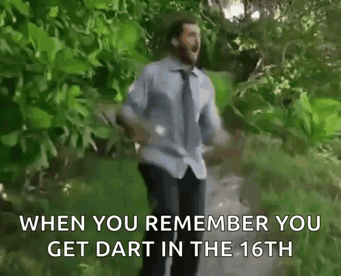 Man in Blue Shirt and Tie Running in Woods