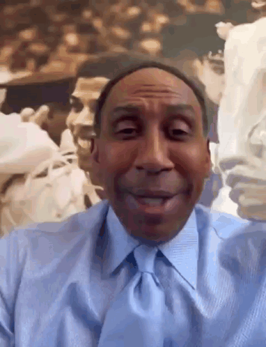 Man in Blue Shirt and Tie Smiling