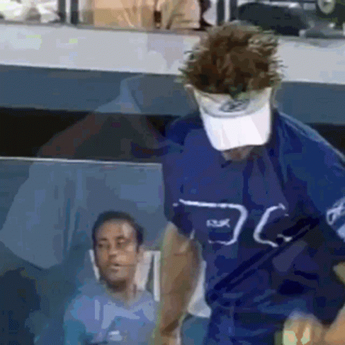 Man In Blue Shirt And Visor GIF