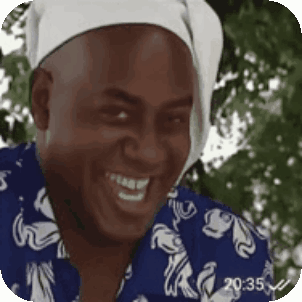 Man in Blue Shirt and White Bandana Smiling