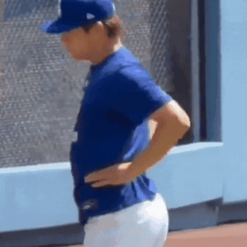 Man in Blue Shirt and White Pants on Baseball Field