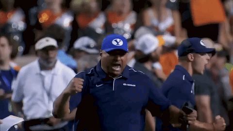 Man in Blue Shirt and White Shorts in Stadium