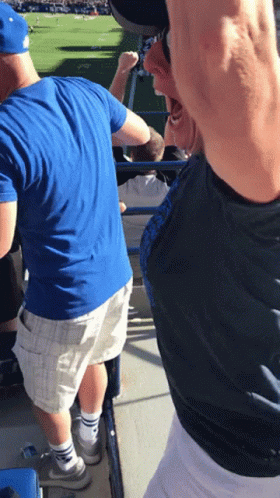 Man in Blue Shirt and White Shorts in Stadium