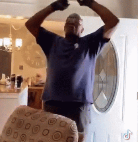 Man In Blue Shirt Arms Outstretched GIF