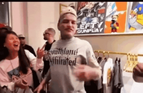 Man In Blue Shirt At Mic Saying To The Left GIF