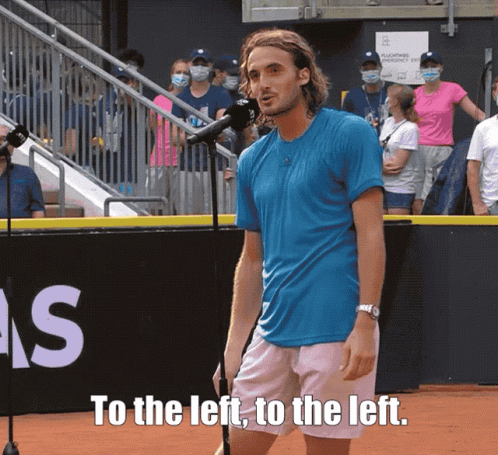 Man In Blue Shirt At Microphone To The Left To The Left GIF