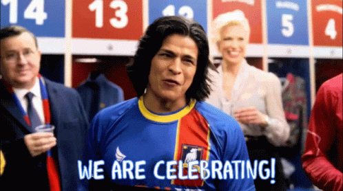 Man in Blue Shirt Celebrating
