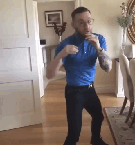Man in Blue Shirt Dancing