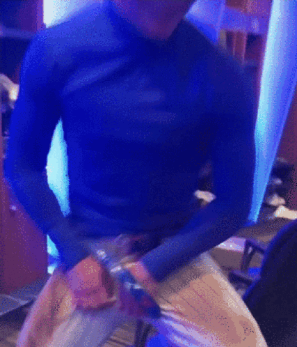 Man in Blue Shirt Dancing in Blue Room