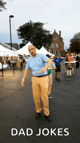 Man In Blue Shirt Dancing In Parking Lot Dad Jokes GIF