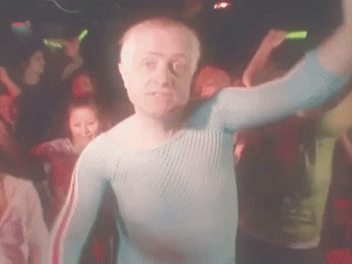 Man in Blue Shirt Dancing